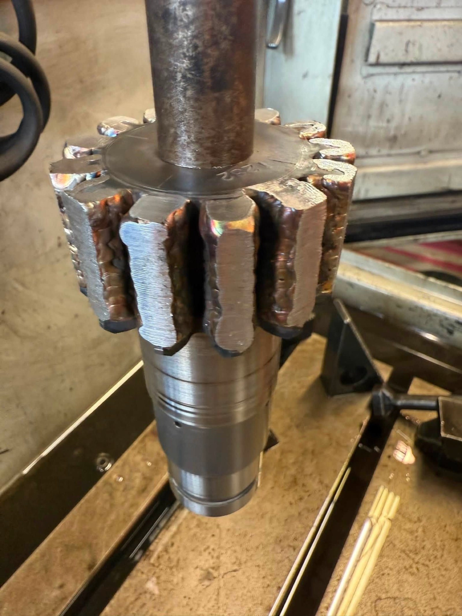 Rebuilt teeth on an industrial gear